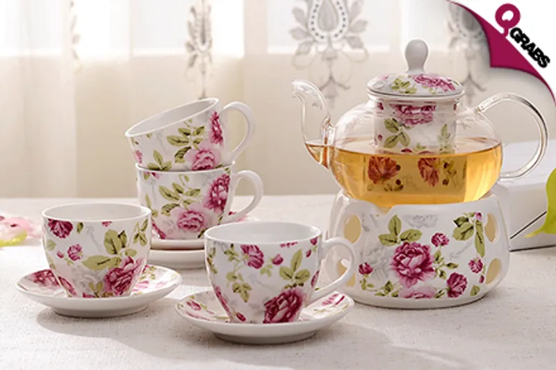From QR129 Drink Up with an Elegant Glass & Ceramic Tea Set - Includes Teapot, Teacups, Saucers & Teapot Warmer! (Up to QR398 Value)